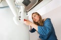 Close-up Of Woman Fixing Sink Pipe With Wrench Royalty Free Stock Photo