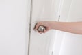 Close-up young woman handle stainless door knob, Women are opening door,Close up door knob. Royalty Free Stock Photo