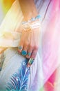 Close up of young woman hands hold dress with boho accessories r