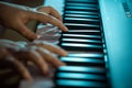 Close up of young woman hands playing on the piano, instrument Royalty Free Stock Photo