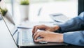 Close up of young woman hands typing on laptop computer keyboard Royalty Free Stock Photo