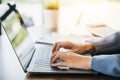 Close up of young woman hands typing on laptop computer keyboard Royalty Free Stock Photo