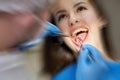 Woman having teeth check up at dentist office with motion blur effect Royalty Free Stock Photo