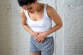 Close up of beautiful woman body suffering from stomachache, period pain and menstrual cramps Royalty Free Stock Photo