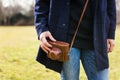 Close up of young woman hipster holding retro film camera in hands. Royalty Free Stock Photo