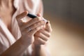 Young woman check blood sugar lever with glucometer