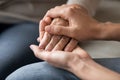 Close up young woman holding female hand of older mother Royalty Free Stock Photo