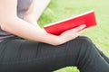 Close-up of young woman holding and reading a book Royalty Free Stock Photo