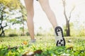 Close up of a young woman legs in warming up the body by stretching her legs before morning excercise and yoga on the grass. Royalty Free Stock Photo