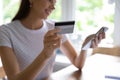 Close up of woman make payment on cellphone with card Royalty Free Stock Photo