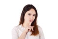 Close up of young woman making silence gesture. Royalty Free Stock Photo