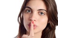 Close up of young woman making silence gesture. Royalty Free Stock Photo