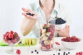 Close up of a young woman prepare to blending fruits Royalty Free Stock Photo