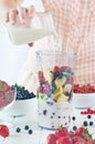 Close up of a young woman prepare to blending fruits Royalty Free Stock Photo