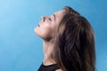 Close-up of a young woman in profile with closed eyes