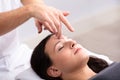 Woman Receiving Reiki Treatment