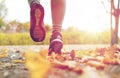 Close up of young woman running in autumn park Royalty Free Stock Photo