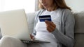 Young woman shopping on laptop at home online Royalty Free Stock Photo