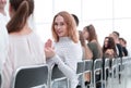 close up. young woman sitting in a row with her associates. Royalty Free Stock Photo