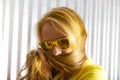 Close up young woman in sunglasses playing tricks with her hair Royalty Free Stock Photo