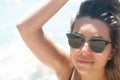 Close-up of a young woman with sunglasses sunlight