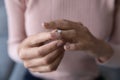 Close up woman taking off wedding ring, divorce concept Royalty Free Stock Photo