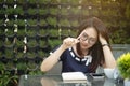 Close-up young woman thinking about business opportunities Royalty Free Stock Photo