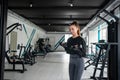 close-up young woman trains muscles on exercise machine in the gym. Royalty Free Stock Photo