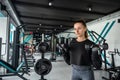 close-up young woman trains muscles on exercise machine in the gym. Royalty Free Stock Photo