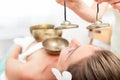 Sound massage with singing bowls and cymbals Royalty Free Stock Photo