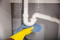 Woman Using Towel Under Leaking Sink Pipe Royalty Free Stock Photo