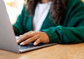 Close up Young woman using laptop at table