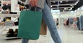 Close up of young woman walks with colorful shopping bags around a shopping mall. Shopping after quarantine. Royalty Free Stock Photo