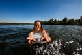 Close-up of young woman who floats on the river on wakesurf board Royalty Free Stock Photo