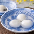 Close up of yuanxiao tangyuan in a bowl on gray table, food for Chinese Lantern Yuanxiao Festival