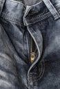 Close-up zipper open on blue shabby jeans, denim texture, zipper jeans pants Royalty Free Stock Photo