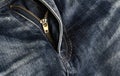Close-up zipper open on blue jeans, denim texture, zipper jeans pants Royalty Free Stock Photo