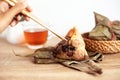 Close up Zongzi or rice dumpling on the wooden table with Chinese tea in Dragon Boat Festival, Asian traditional food Royalty Free Stock Photo