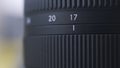 Close up of zoom scale on black digital camera lens. Action. Close up of professional photographing equipment details on Royalty Free Stock Photo