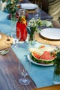 Close upof a set table at a summer garden party. Table setting with glasses, lemonade, fresh fruits lemonade and