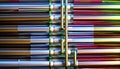 Close-ups of colorful reflective industrially manufactured metal parts stored next to each other after production