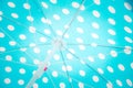 Close upward view of a blue dotted beach umbrella