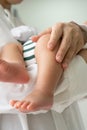 Vertical of baby left leg with handle gently Royalty Free Stock Photo