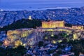 Close view of Acropolis hill with Parthenon and Erechtheion and Philoppapos monument at night, Athens, Greece. UNESCO