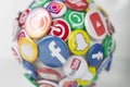 close view on a ball with various social media logos like facebook youtube twitter whatsapp and snapchat