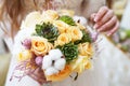 Close view of beautiful colorful wedding bouquet in a hand of a bride Royalty Free Stock Photo