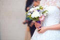 Close view of beautiful colorful wedding bouquet in a hand of a bride Royalty Free Stock Photo