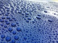 Close view on car paint polished with water drops beading Royalty Free Stock Photo