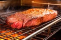 close view of a brisket being probed on a commercial grill Royalty Free Stock Photo