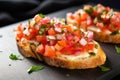 close view of bruschetta with pickled garlic on a crisscrossed napkin